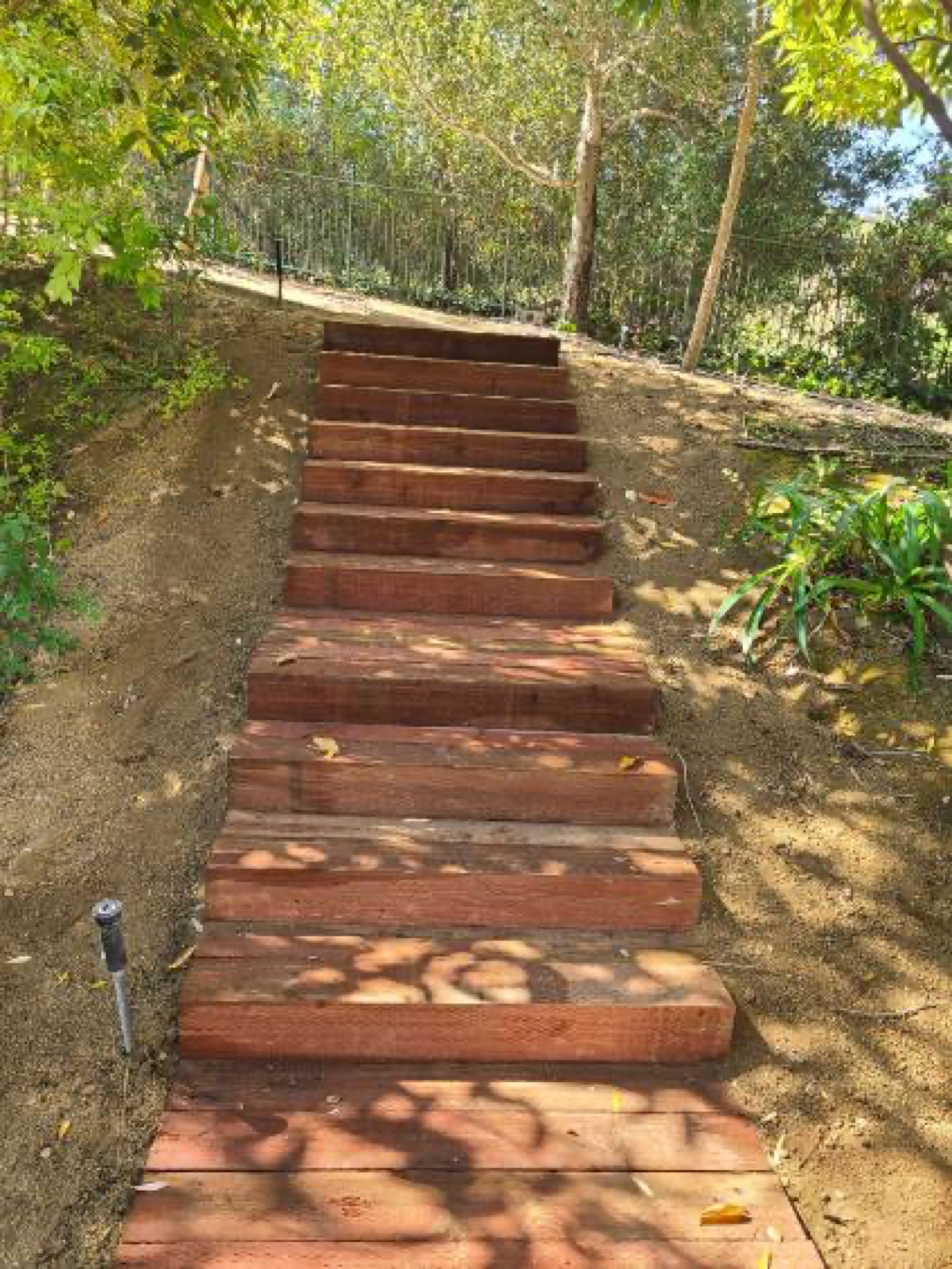 Wood-tie garden steps cut into a hillside